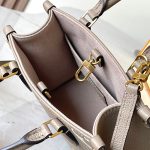 louis-vuitton-onthego-bb-bicolour-monogram-empreinte-leather-handbags–M47054_PM2_Front_view